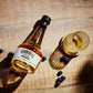 O'Donnell & St.Kilian Blueberry Moonshine Flasche umgeben von Blaubeeren